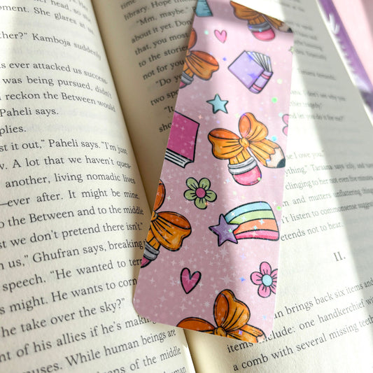 Colorful bookmark with cartoon designs on an open book