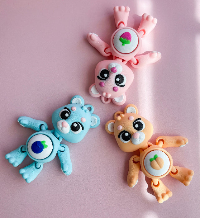 Three colorful animal-shaped clips on a pink background