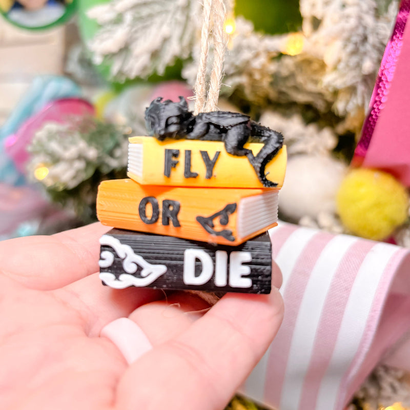 book stack with dragons with christmas tree in background