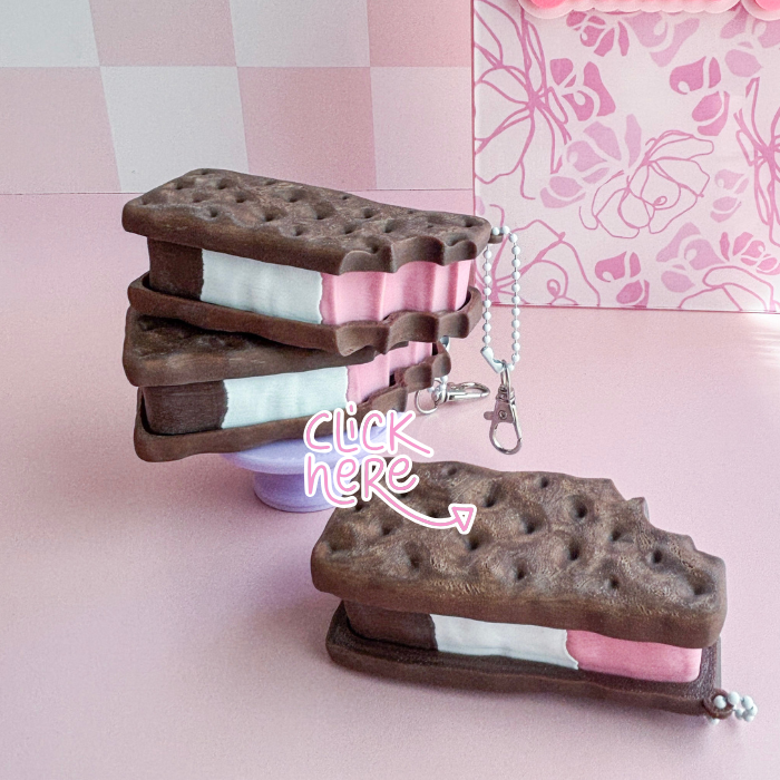 Ice cream sandwich keychain on a pink background with floral pattern
