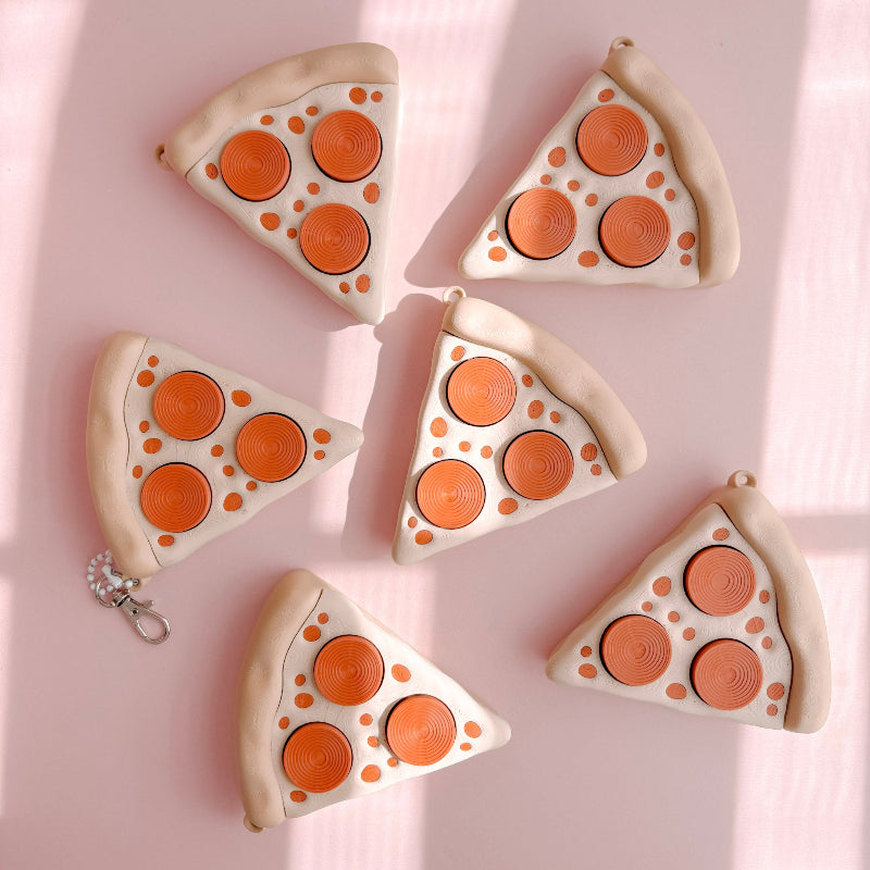 Fidget Clicker designed like a pizza with slices on a pink background
