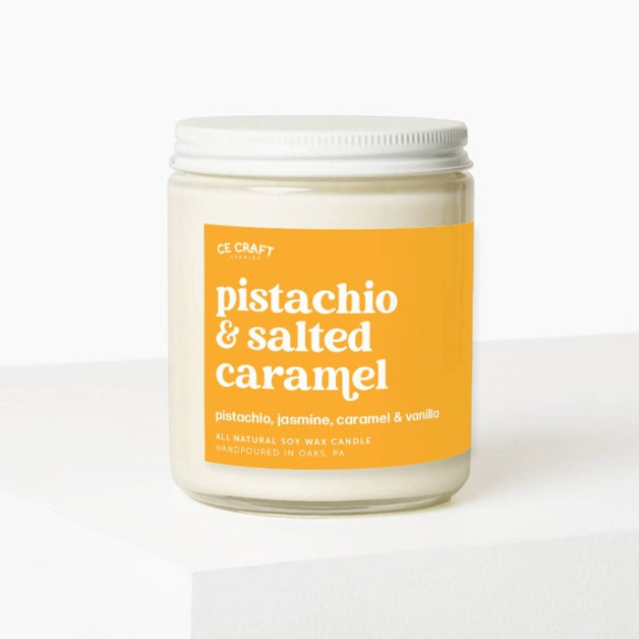 Pistachio &amp; Salted Caramel Scented Candle: the perfect blend of playful pistachio and sweet caramel, accented with floral jasmine and warm notes of sandalwood and vanilla, with a hint of salt for a unique twist.