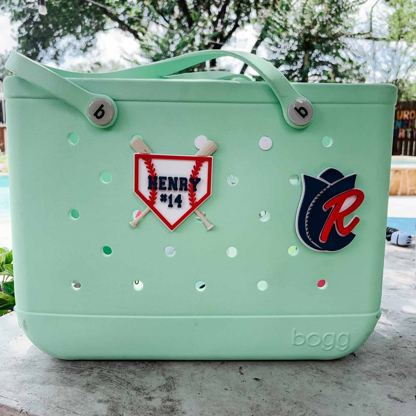 Bogg bag with baseball themed charms 