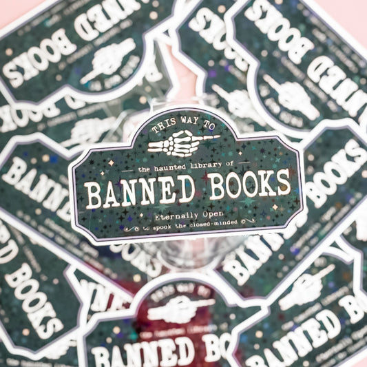 Sticker with 'Banned Books' design on a patterned background