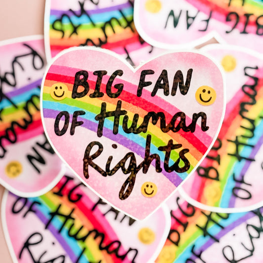 Heart-shaped sticker with 'BIG FAN OF Human Rights' text on a rainbow background