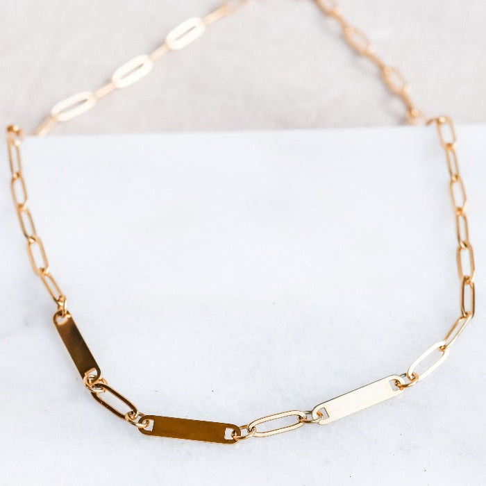Elevate your style with our 3-Bar Paperclip Chain Necklace in gold. This fully customizable necklace features a sleek design and can be laser engraved in your choice of font. Make a statement and stand out from the crowd with this unique and personalized piece.