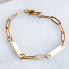 Elevate your style with our 2-Bar Paperclip Chain Bracelet in gold. This fully customizable necklace features a sleek design and can be laser engraved in your choice of font. Make a statement and stand out from the crowd with this unique and personalized piece.