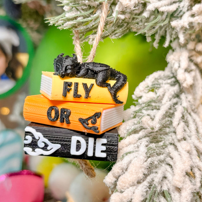 book stack with dragons with christmas tree in background