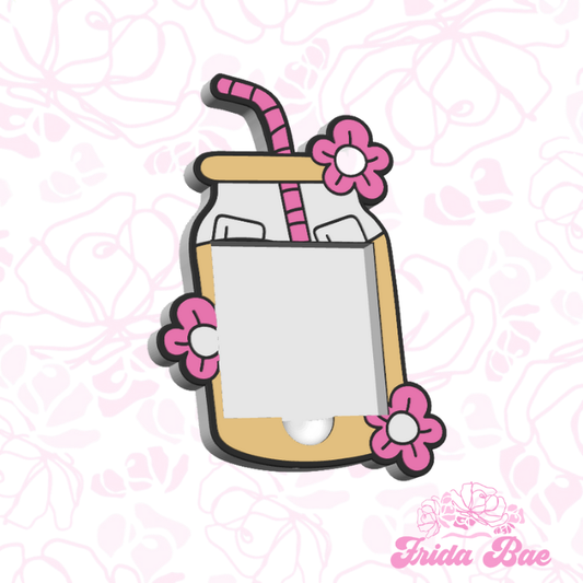 Cartoon-style glass with flowers and a straw on a pink floral background, featuring the brand 'Frida Bae'.