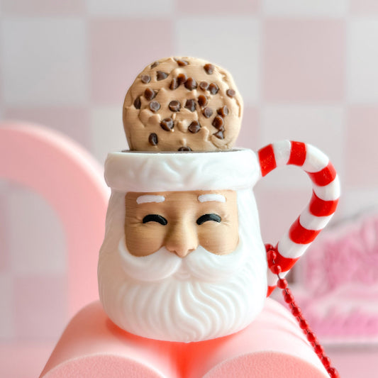 Santa Claus cookie jar fidget clicker with a cookie on top against a pink background