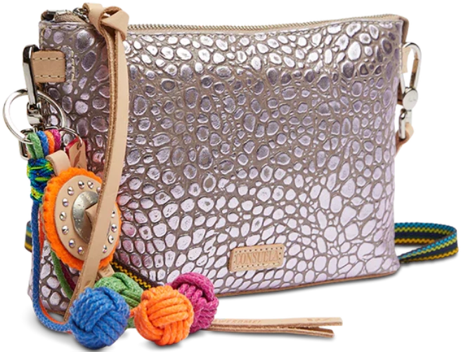 Keep your phone, keys, and wallet in this take-anywhere crossbody! An open pocket and a credit card slot pocket make this colorful leather crossbody bag a go-to for heading out the door. 