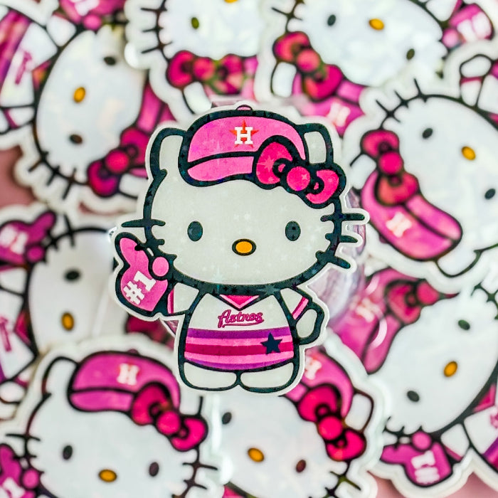 Sticker of Hello Kitty in a pink baseball cap and uniform on a background of similar stickers.