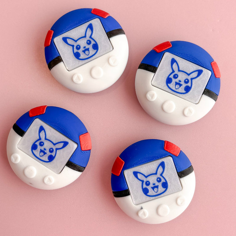 Four round, blue and white objects with a cartoon character on a pink background