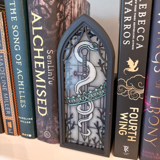stained glass book holder with books on either side