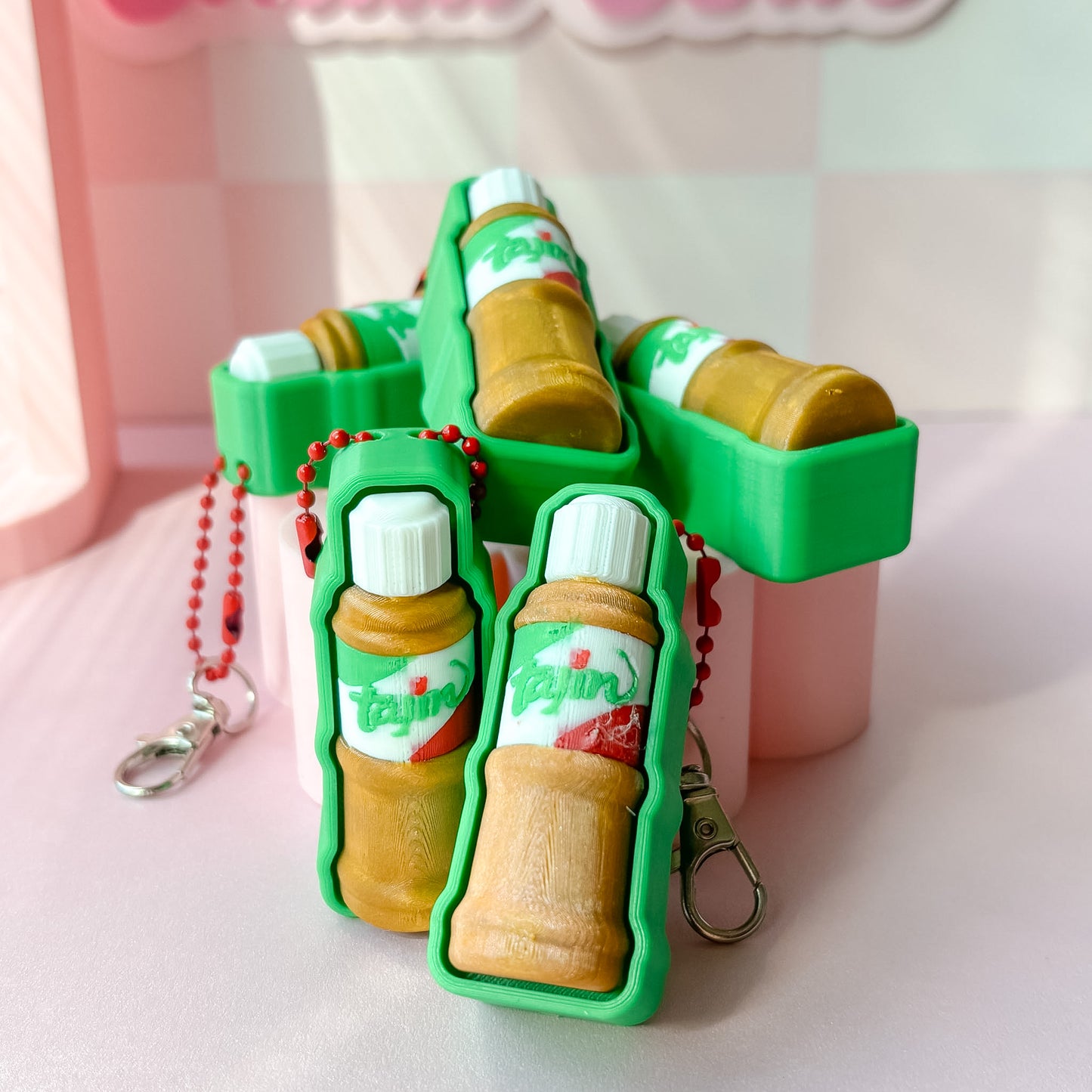 fidget clicker in the shape of tajin bottle green and caramel color