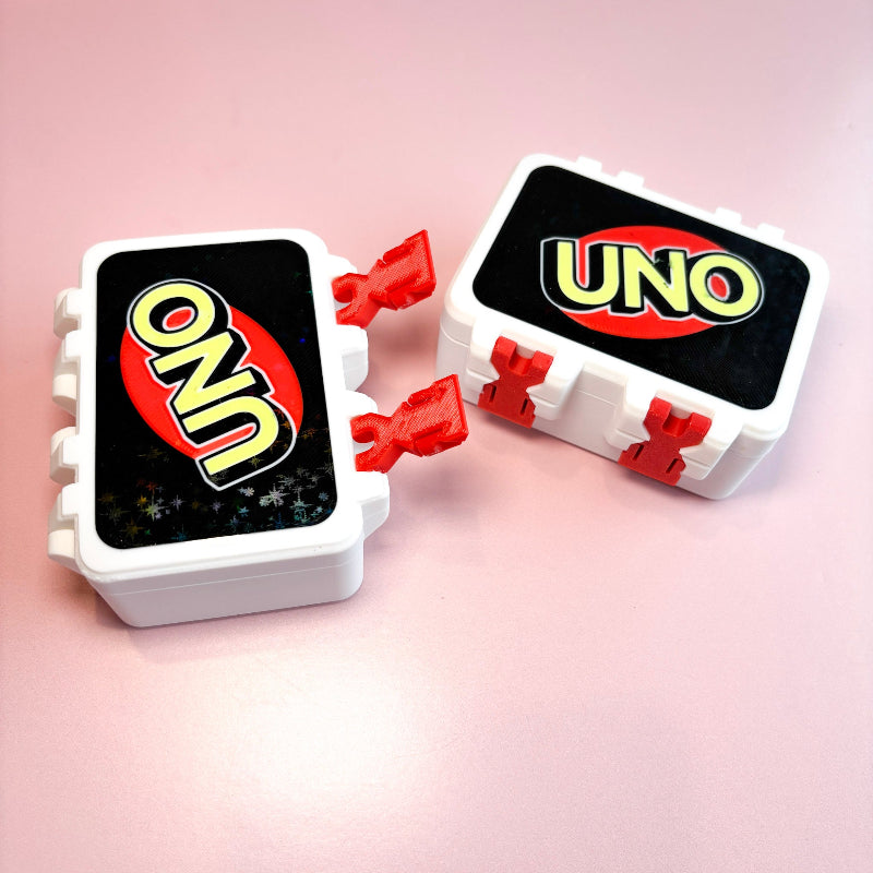 boxes with  UNO wording with pink backgound