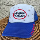 blue and white foam trucker hat with american made patch in red white and blue