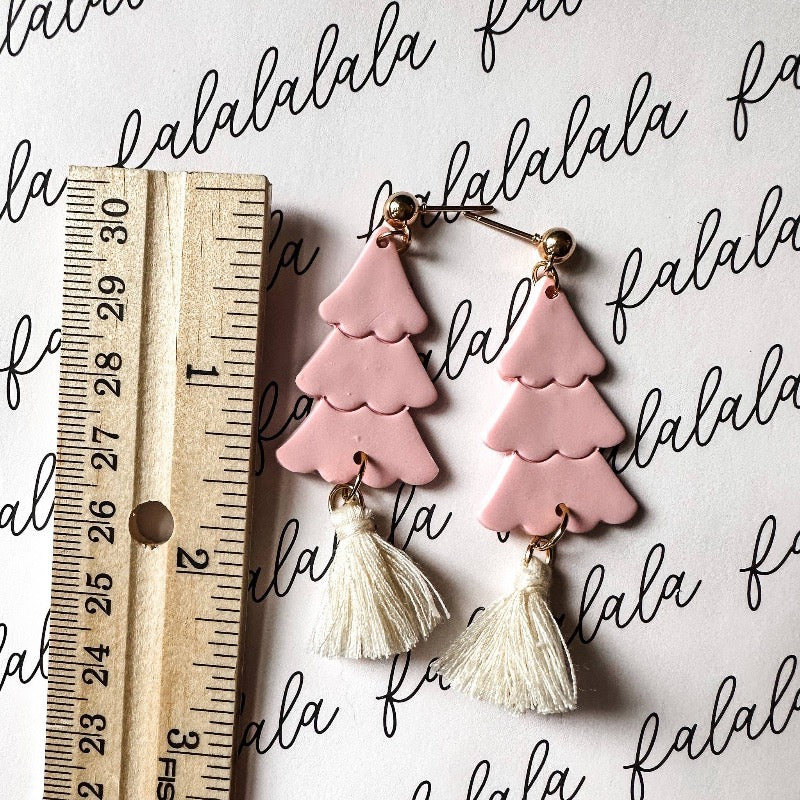 Feel festive this Christmas season with these fun green tassel earrings! Handmade with love and crafted from quality polymer clay, you'll be admiring these holiday-inspired goodies all season long. Put a little Christmas cheer in your style!
