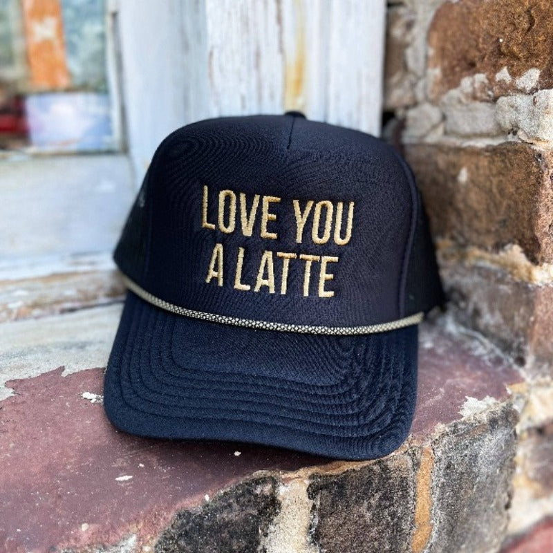We are loving our "Love You a Latte" Foam Trucker - the perfect Valentine's Day accessory! This fun hat features an embroidered graphic on the front, with a comfortable 100% polyester front and breathable mesh back. The adjustable snap ensures a perfect fit for adults between 6 1/2 - 7 5/8. Get yours now and spread the love!